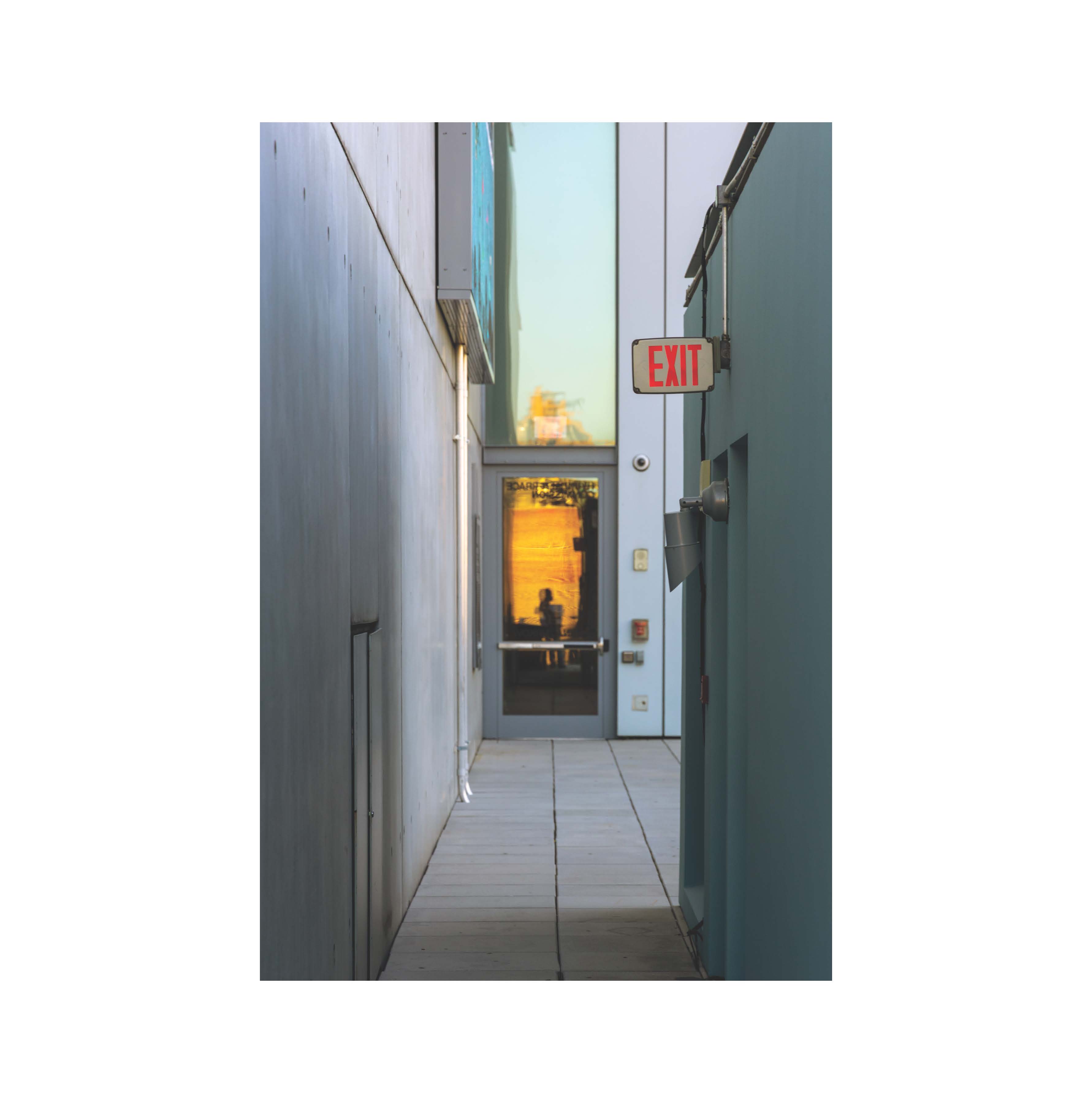 Narrow passage and a reflected figure
