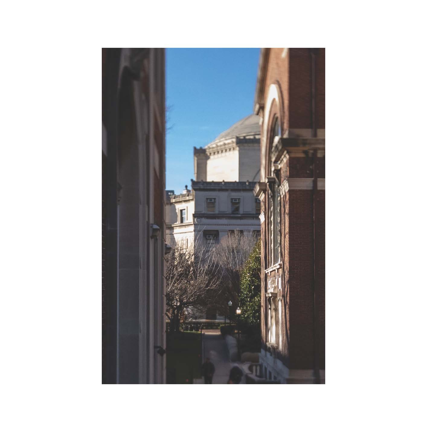 Buildings framing a distant dome